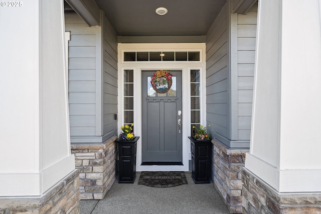 craftsman inspired home with stone siding, concrete driveway, a garage, and a front yard