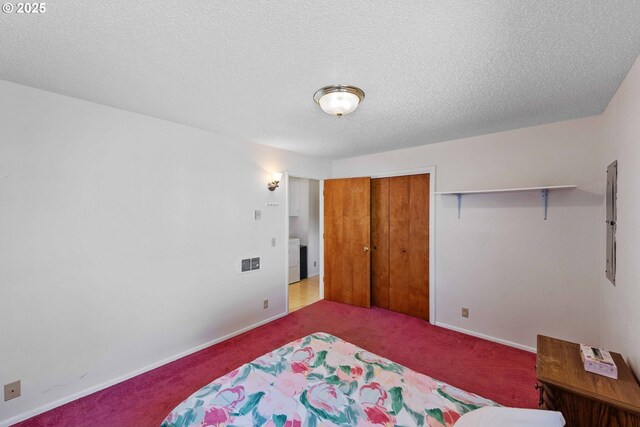 91256 Cape Arago Hwy, Coos Bay, OR 97420 - carpeted bedroom with baseboards, a closet, a textured ceiling, and electric panel