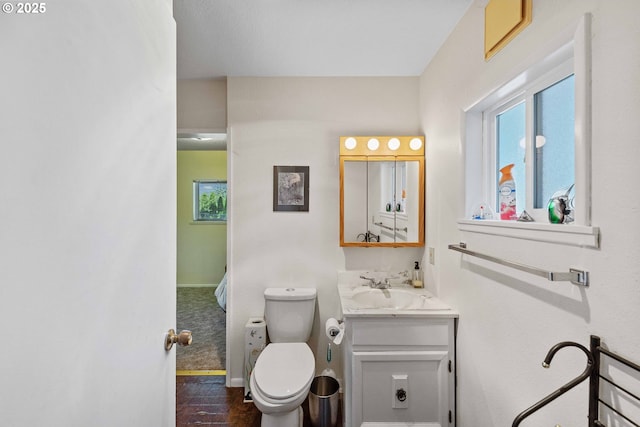 91256 Cape Arago Hwy, Coos Bay, OR 97420 - ensuite bathroom with plenty of natural light, vanity, toilet, and baseboards