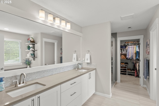 bathroom with vanity and backsplash