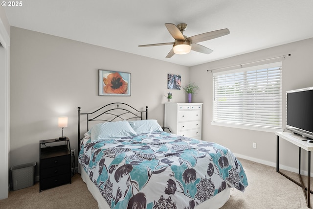 bedroom with ceiling fan and light colored carpet