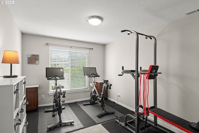 exercise area with a textured ceiling