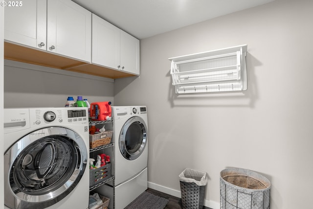 laundry area with cabinets and washer and dryer