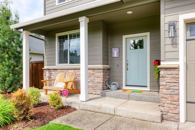 doorway to property featuring a porch