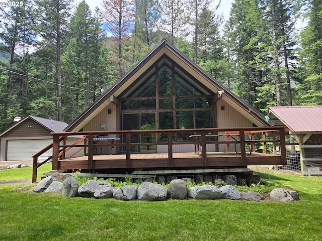60248 Rose Rd, Joseph, OR 97846 - rear view of property with a lawn, a wooden deck, and a detached garage