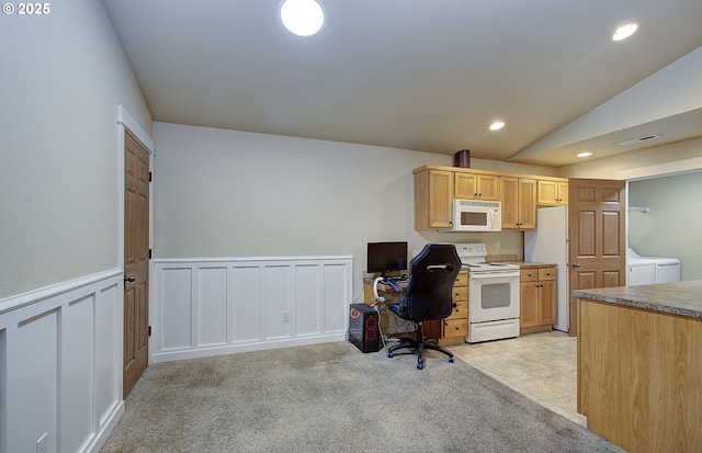 carpeted office featuring washing machine and clothes dryer and lofted ceiling