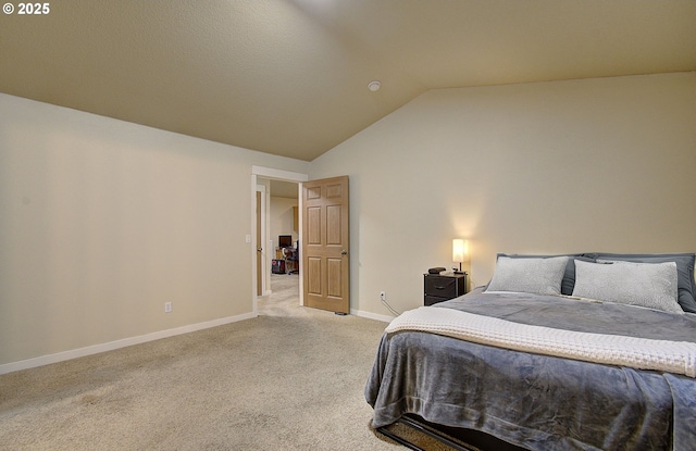 bedroom featuring light carpet and lofted ceiling