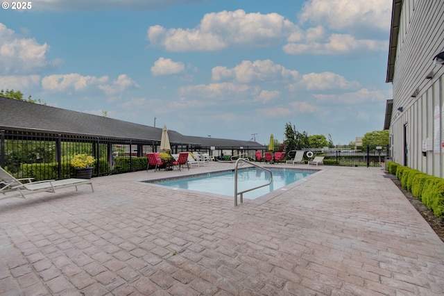 view of swimming pool featuring a patio area