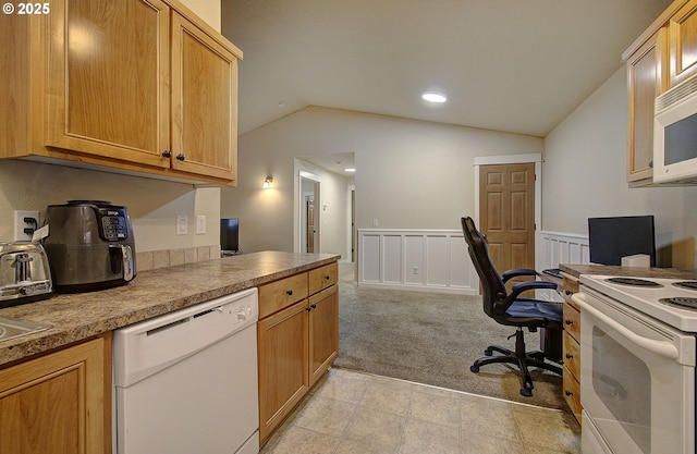 kitchen featuring lofted ceiling, white appliances, and light carpet