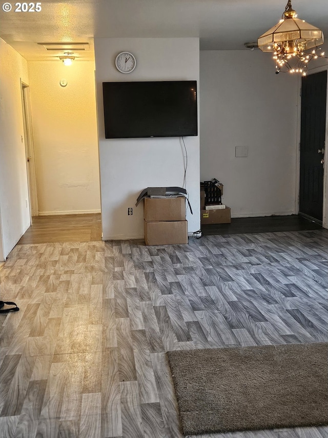 unfurnished living room featuring wood finished floors