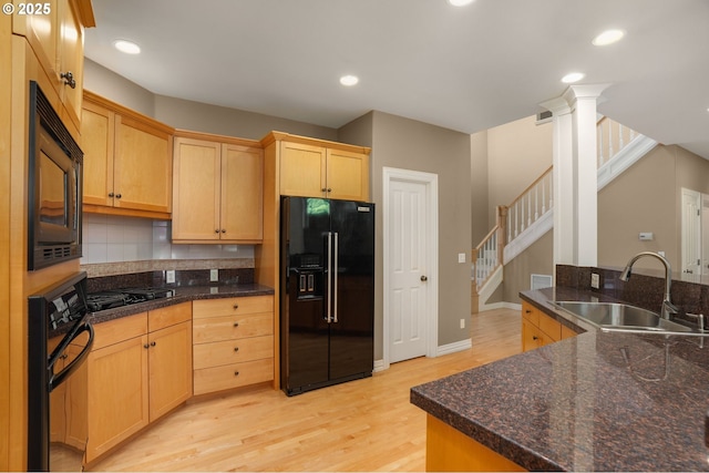 7917 NW Blue Pointe Ln, Portland, OR 97229 - kitchen with black appliances, a sink, light wood-style floors, backsplash, and light brown cabinetry