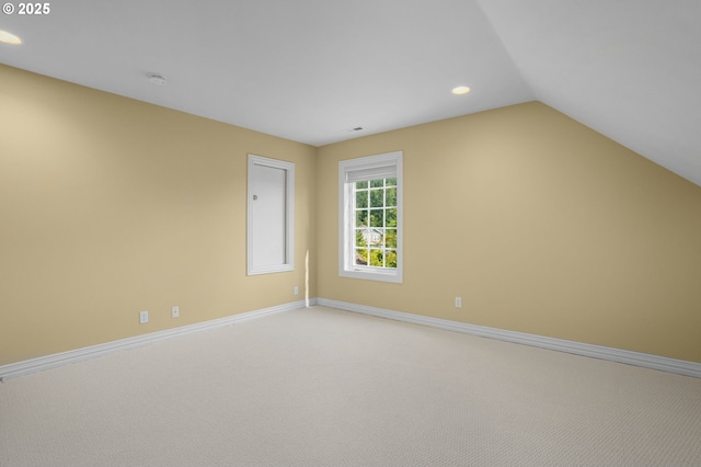 7917 NW Blue Pointe Ln, Portland, OR 97229 - empty room featuring light carpet, baseboards, recessed lighting, a smoke detector, and lofted ceiling