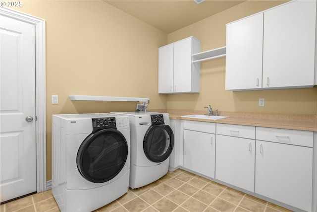 7917 NW Blue Pointe Ln, Portland, OR 97229 - laundry area with independent washer and dryer, cabinet space, and light tile patterned flooring