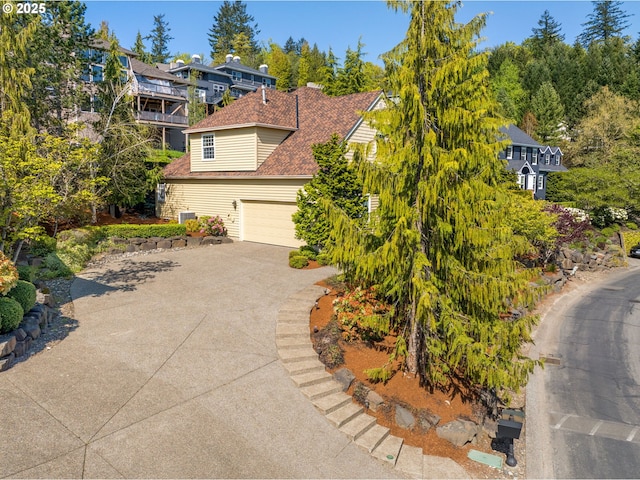 7917 NW Blue Pointe Ln, Portland, OR 97229 - view of front of home featuring driveway and a garage