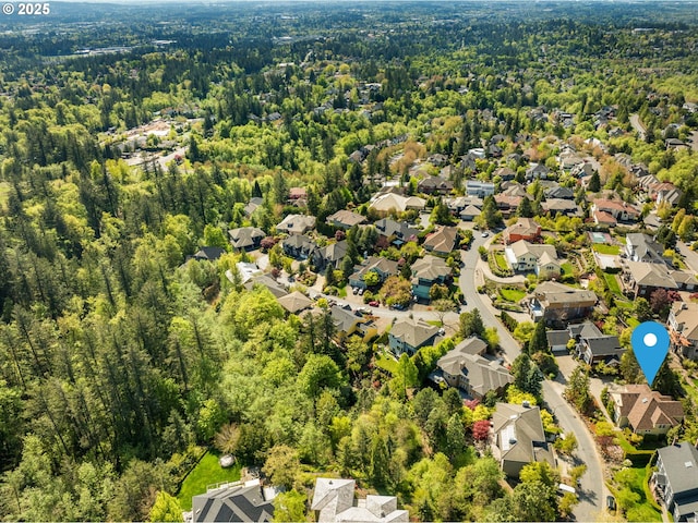 7917 NW Blue Pointe Ln, Portland, OR 97229 - aerial perspective of suburban area with a heavily wooded area