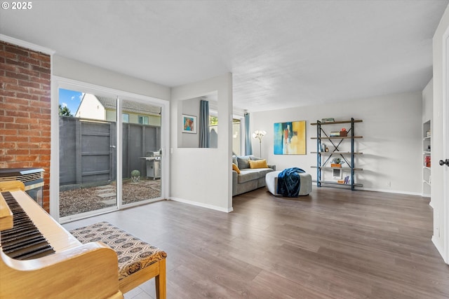 251 NE Village Squire Ave Unit 2, Gresham, OR 97030 - living area with baseboards and wood finished floors