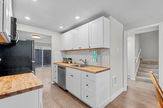 251 NE Village Squire Ave Unit 2, Gresham, OR 97030 - kitchen with wooden counters, appliances with stainless steel finishes, light wood finished floors, backsplash, and recessed lighting