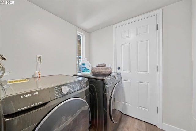 251 NE Village Squire Ave Unit 2, Gresham, OR 97030 - washroom featuring washer and dryer and wood finished floors