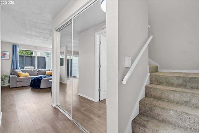 251 NE Village Squire Ave Unit 2, Gresham, OR 97030 - stairway featuring wood finished floors and baseboards