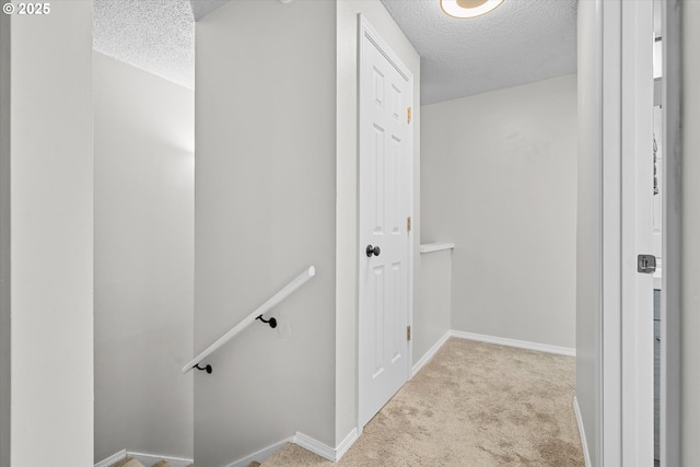 251 NE Village Squire Ave Unit 2, Gresham, OR 97030 - hall featuring a textured ceiling, an upstairs landing, and carpet