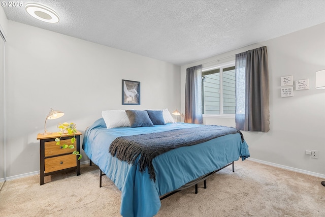 251 NE Village Squire Ave Unit 2, Gresham, OR 97030 - carpeted bedroom featuring a textured ceiling and baseboards