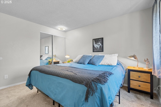 251 NE Village Squire Ave Unit 2, Gresham, OR 97030 - bedroom featuring carpet floors, a closet, and a textured ceiling
