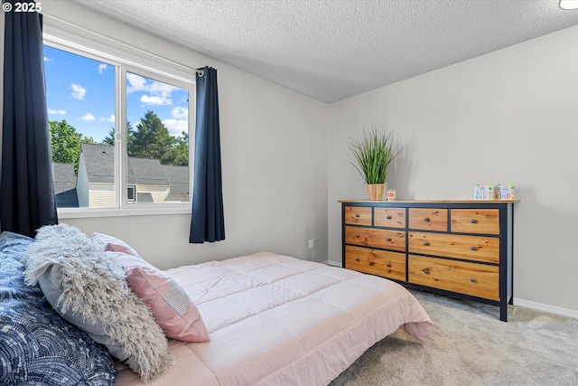 251 NE Village Squire Ave Unit 2, Gresham, OR 97030 - carpeted bedroom featuring a textured ceiling