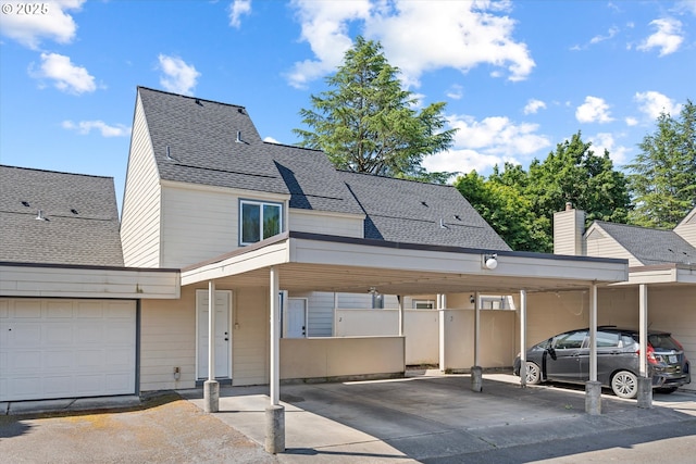 251 NE Village Squire Ave Unit 2, Gresham, OR 97030 - view of front of house featuring a shingled roof and covered parking