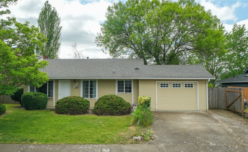 588 SE Powell Ave, Corvallis, OR 97333 - ranch-style house with an attached garage, driveway, and roof with shingles