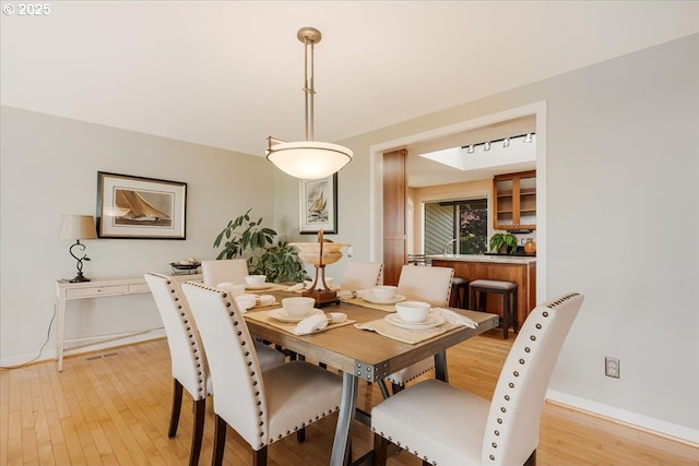 31430 NE Canter Ln, Sherwood, OR 97140 - dining room featuring light wood-style flooring and baseboards