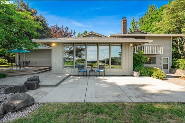 31430 NE Canter Ln, Sherwood, OR 97140 - rear view of property with a patio and a chimney