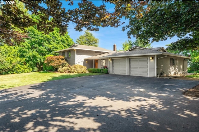 31430 NE Canter Ln, Sherwood, OR 97140 - view of front of home featuring driveway, a garage, and a front yard