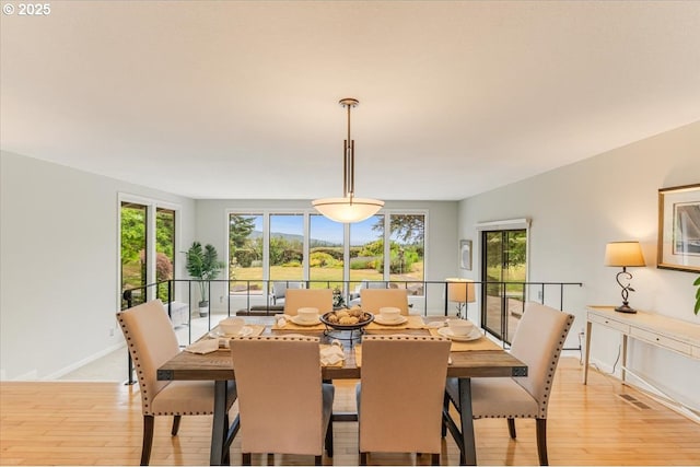31430 NE Canter Ln, Sherwood, OR 97140 - dining space with light wood-style floors and healthy amount of natural light