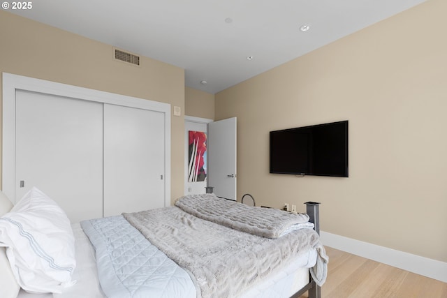 1001 NW Lovejoy St Unit 710, Portland, OR 97209 - bedroom with light wood finished floors and a closet