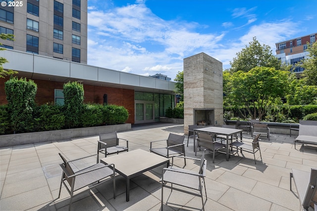 1001 NW Lovejoy St Unit 710, Portland, OR 97209 - view of patio / terrace featuring an outdoor stone fireplace