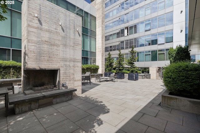 1001 NW Lovejoy St Unit 710, Portland, OR 97209 - view of patio / terrace with an outdoor stone fireplace