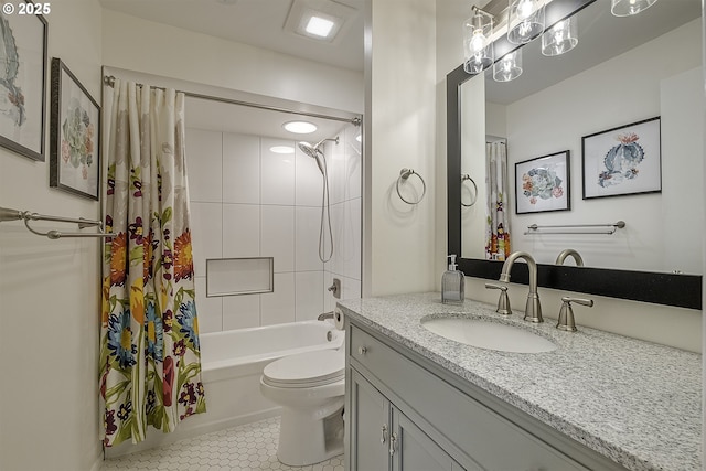 full bathroom featuring vanity, toilet, tile patterned flooring, and shower / tub combo