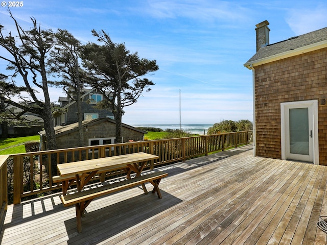 wooden terrace with outdoor dining space