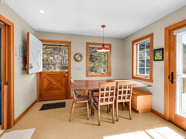 dining room featuring baseboards and recessed lighting