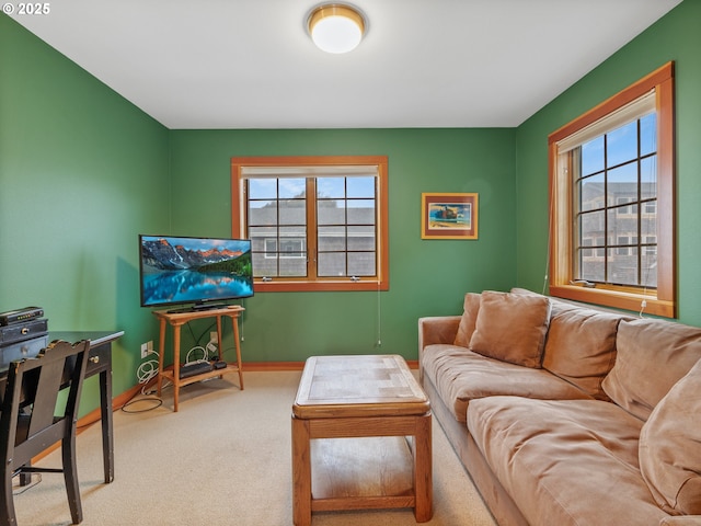 living room with carpet and baseboards