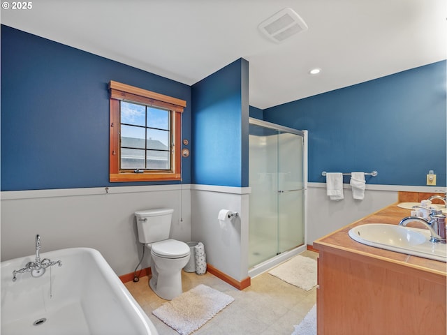 full bath with a sink, a stall shower, a soaking tub, and toilet