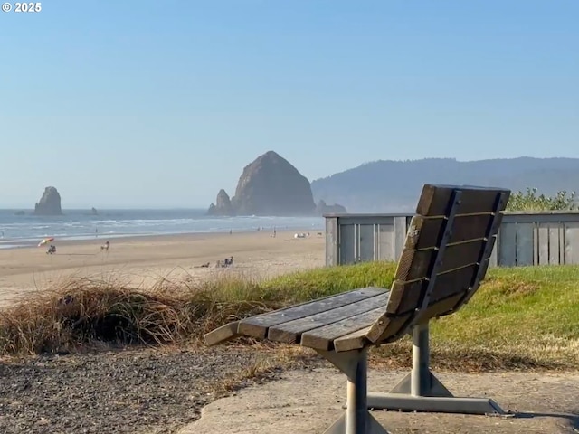 view of home's community featuring a water and mountain view