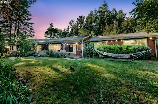32739 Taylor Butte Rd, Cottage Grove, OR 97424 - rear view of house featuring a lawn, covered porch, and a chimney