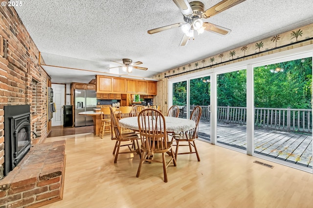 32739 Taylor Butte Rd, Cottage Grove, OR 97424 - dining room featuring a textured ceiling, light wood finished floors, and ceiling fan