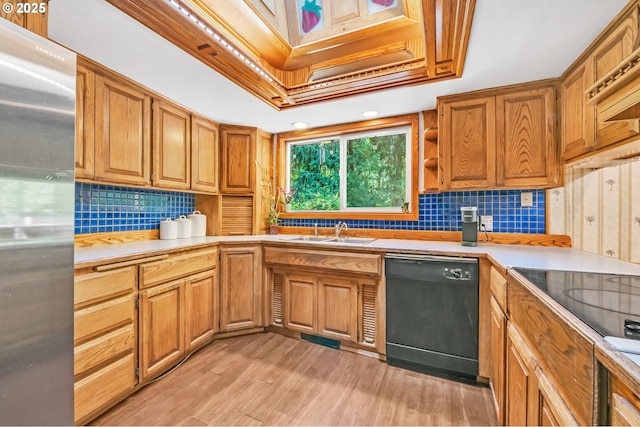 32739 Taylor Butte Rd, Cottage Grove, OR 97424 - kitchen featuring stainless steel fridge, black dishwasher, tasteful backsplash, light countertops, and light wood-style floors