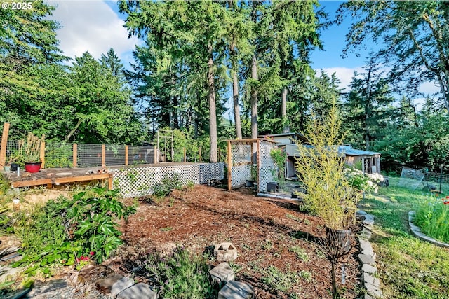32739 Taylor Butte Rd, Cottage Grove, OR 97424 - view of yard featuring an outbuilding, view of wooded area, and a vegetable garden