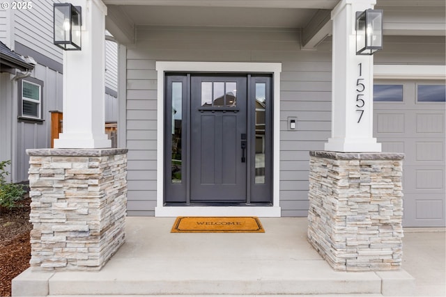 doorway to property featuring a garage