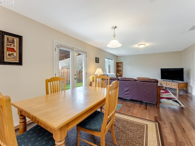 dining room with visible vents and wood finished floors