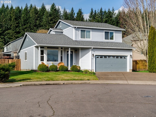 traditional-style house featuring a garage, fence, concrete driveway, and roof with shingles