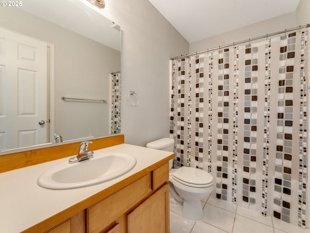 bathroom featuring a shower with shower curtain, vanity, toilet, and tile patterned floors